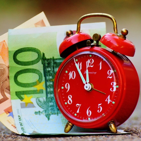 alarm clock with money, time is money